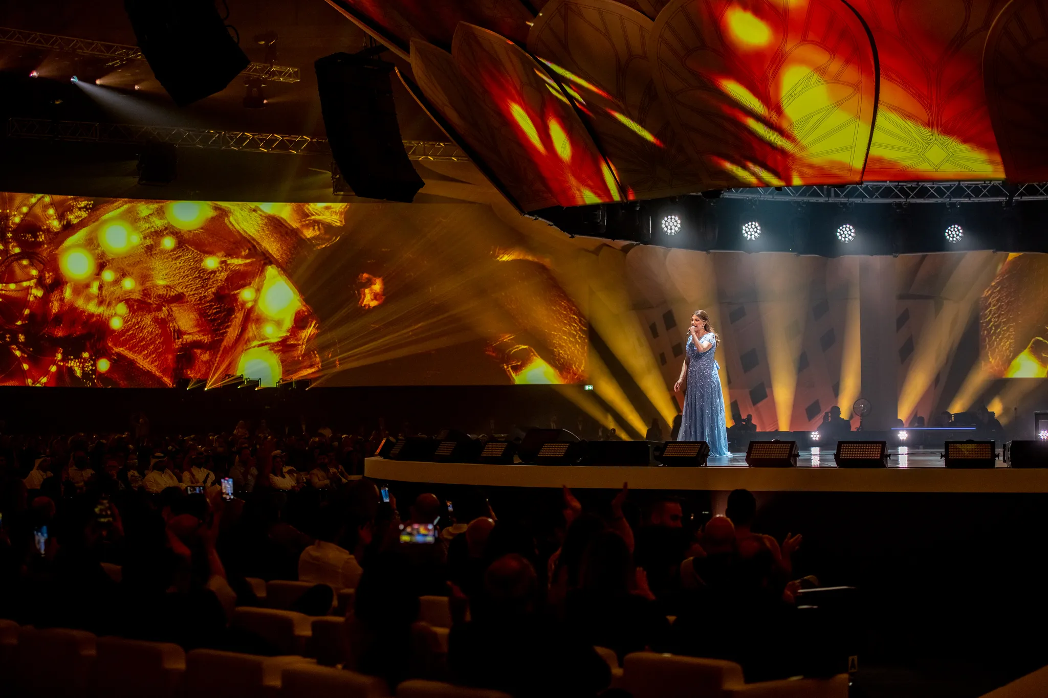Qatar Live 2021 was conceived as a cultural and creative landmark for the Arab Cup, a spectacular fusion of tradition and technology. With PHNTM leading the creative direction, Take Me Live was brought in as the execution partner to reimagine the Doha Exhibition and Convention Center into an immersive, never-before-seen live event arena. The vision was clear: a seamless integration of architectural innovation, immersive content, and emotionally charged stage design that celebrated the spirit of Doha on a global platform.